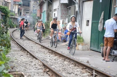 Feel hanoi’s daily rhythm on a guided bike tour—cross long bien bridge, pedal banana island farms, meet locals, and try egg coffee. includes pickup & lunch.