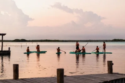 Wake up early for a sunrise paddleboard or kayak tour in bacalar lagoon, with photos, snacks, and a local guide. includes bottled water and all gear.