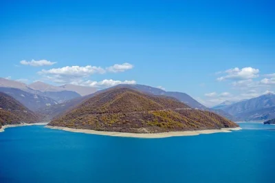 Private kazbegi tour from tbilisi with stops at zhinvali reservoir, ananuri fortress, gudauri panorama, and gergeti church. full-day guided trip.