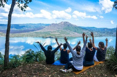 Experience a mindful nature walk, yoga, and tree planting at mount abang in bali. includes bird release, meditation, and holy water cleansing. book now.