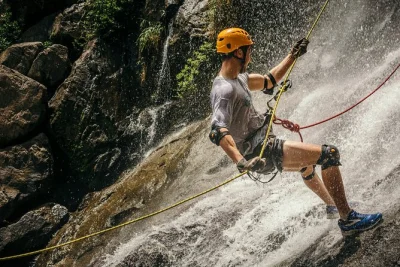 Experience waterfall rappelling at antelope falls in bocawina, belize. guided rainforest hike, rope descent, and swim in emerald pools. book your spot now.