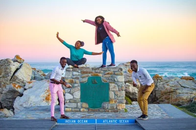Experience cape agulhas, see african penguins at stony point, taste hemel-en-aarde wines, and explore elim village on a full-day private tour.