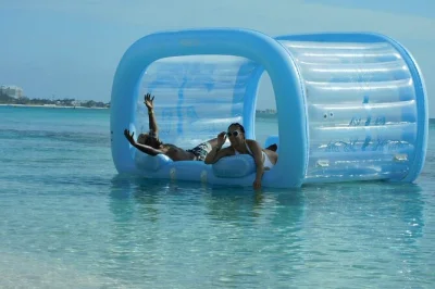 Feel the caribbean sun on a private ocean cabana float in the cayman islands, with cool drinks, music, and a 4k drone video included. safe for all ages.
