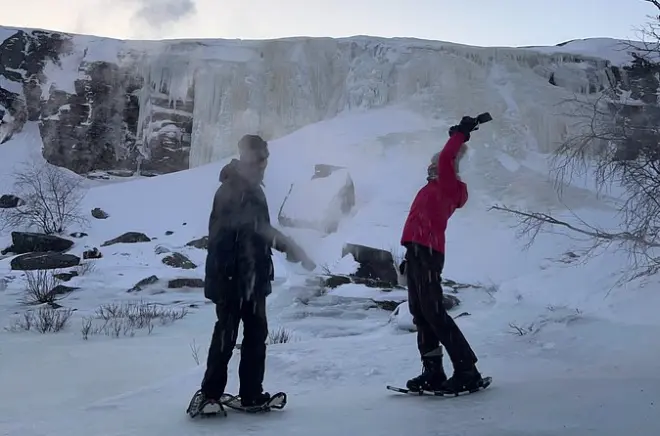 Snowshoe hike to frozen Orvvosfossen waterfall, Alta