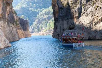 Explore green canyon, manavgat waterfall, and oymapinar dam on a guided cruise and cabrio bus tour from side. includes lunch, boat ride, and hotel pickup.