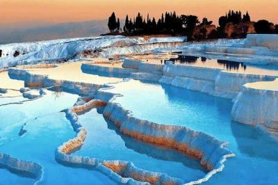 Let the surreal white terraces of pamukkale and ancient hierapolis surprise you on this day trip from kusadasi or selcuk, with hotel pickup, entry fees, and lunch included.