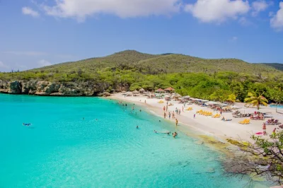 Feel the sand, taste bandabou’s flavors, and ride a utv to curacao’s top beaches with lunch, snorkeling gear, and semi-private pickup included.