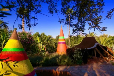 Slip out of marrakech’s noise into anima garden—botanical art, atlas views, museum rooms, and fresh juice at café paul bowles. includes shuttle transfer.