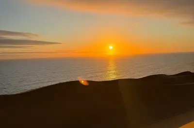 Sunset Sandwich Harbour tour from Walvis Bay: Dunes meet ocean