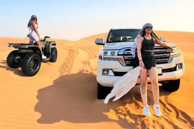 Vivez l’aventure du désert de dubaï avec quad, dune bashing, balade à dos de chameau et barbecue dans un camp bédouin. prise en charge à l’hôtel et guide local inclus pour une soirée sans s