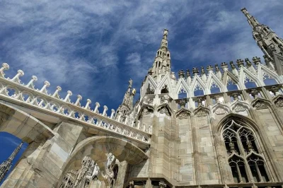 Step inside milan’s duomo, wander its marble rooftop terraces, and hear stories from a local guide. includes entry tickets, elevator access, and small group setting.