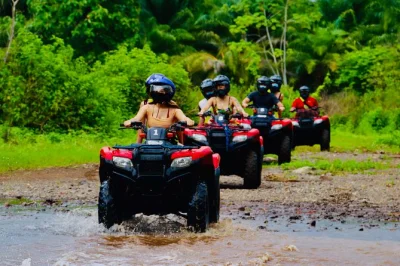 Feel the rush of an atv rainforest adventure near manuel antonio, hike to a hidden waterfall for a swim, enjoy fresh fruit and a costa rican meal, with pickup included.