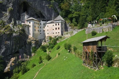 Feel the chill of postojna cave’s underground world and wander predjama castle’s secret corners on a small group day trip from ljubljana, with transport included.