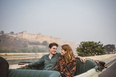 Start your jaipur day trip with samosas & lassi, explore hawa mahal, royal gaitor, jal mahal, and end at the monkey temple for a sunset view. includes pickup.
