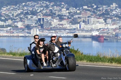 Feel the rush of a v8 trike ride through dunedin’s city streets and otago peninsula, with photo stops, local insights, and all gear included for your comfort.