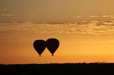 Feel the outback wake up from above on a sunrise balloon flight near alice springs, with macdonnell ranges views, wildlife spotting, and sparkling wine at landing. includes pickup.