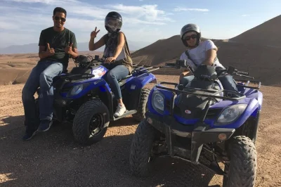 Feel the agafay desert at sunset with a camel ride, quad biking, and berber dinner. includes marrakech pickup, local guide, and traditional meal under the stars.
