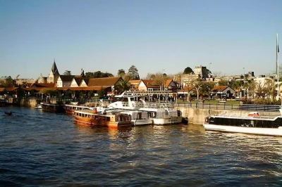Feel the rhythm of buenos aires’ tigre delta on a premium boat tour, stroll puerto de frutos, and enjoy local empanadas with pickup included.