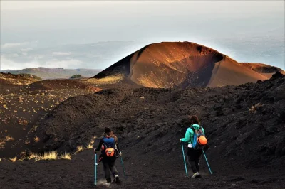 Step onto etna’s black sand, trek ancient lava flows, and explore a hidden lava tunnel with gear included—private transfer from catania makes it easy to join.