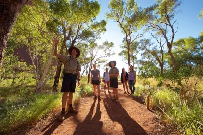 Watch uluru change colors at sunset, walk to kantju gorge & mutitjulu waterhole, and enjoy sparkling wine away from the crowds. includes pickup from ayers rock resort.