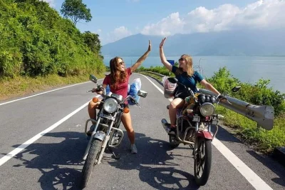 Ride from hue to hoi an by motorbike, crossing the hai van pass, stopping at quiet villages, local markets, and a fresh lunch on the beach. includes pickup and luggage transfer.