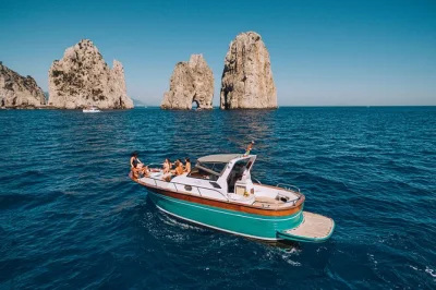 Feel the sea breeze on a capri boat tour from naples, with grottos, faraglioni rocks, island time and a homemade lunch. includes pickup & local skipper.