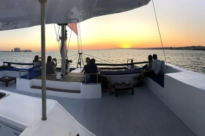 Golden light on the tagus, lisbon’s skyline, and iconic bridges—sail past belém tower and cristo rei with a local guide. includes drinks and easy booking.