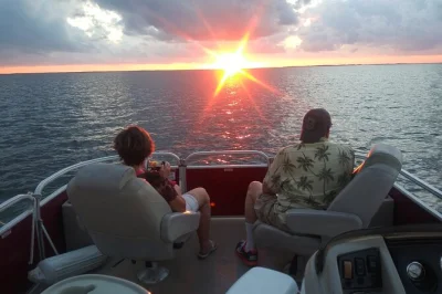 Watch the florida bay sunset from a key largo boat, look for dolphins and manatees, and bring your own drinks. includes water cooler and local crew.