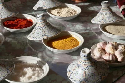 Step inside a marrakech home for a hands-on moroccan cooking class, spice tasting, and mint tea ceremony. includes lunch or dinner, pickup, and local chef guidance.