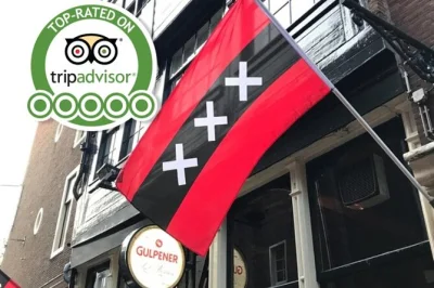 Scopri amsterdam con una guida locale in un tour a piedi privato tra canali, quartiere a luci rosse, piazza dam e cortili nascosti. incluso il trasferimento dall’hotel.