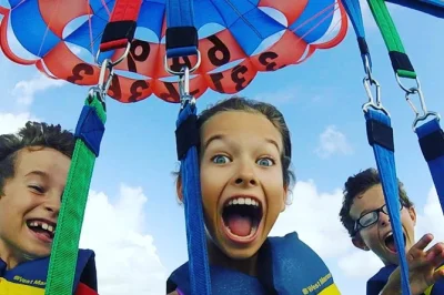 Feel the rush of parasailing over grace bay in turks & caicos, spot sea life below, and relax with hotel pickup and free photos. fly solo or share the sky.