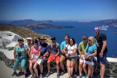 Wander santorini’s iconic villages, blue domes, and black sand beach with a local guide. small group tour includes air-conditioned minivan and bottled water.