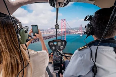 Sinta a energia de lisboa do céu, do rio e das ruas estreitas com um tour em grupo pequeno. inclui voo de helicóptero, passeio de barco pelo tejo até belém e caminhada guiada pela cidade.