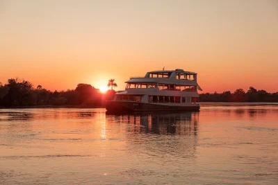 Float past victoria falls on a zambezi river sunset cruise with canapés, drinks, and hotel pickup. watch wildlife, feel the river breeze, and unwind in style.