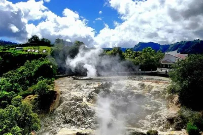 Feel the steam at furnas, taste local tea, and share a slow-cooked cozido lunch on this full-day jeep tour from ponta delgada with pickup and drinks included.