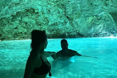 Swim in the blue cave, explore haxhi ali cave, and relax at grama bay on this speed boat tour from vlore. includes guide, snacks, and all safety gear.