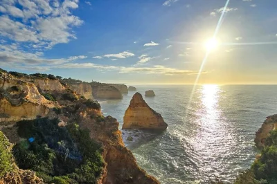 Feel the thrill of hiking algarve’s benagil cliffs, see sea caves, explore praia da marinha & relax at senhora da rocha. includes van transfer & local guide.
