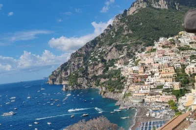 Soak up the amalfi coast’s colors and scents on a day trip from naples to positano & amalfi, with flexible stops, free time in each town, and an assistant on board.