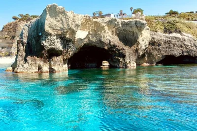 Swim in clear waters, explore sea caves, and enjoy a calabrian aperitif on a boat tour from tropea to capo vaticano. includes snorkeling gear and local guide.