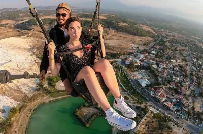 Paragliding at Pamukkale: Soar above white terraces