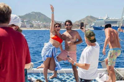 Sail los cabos on a catamaran, snorkel in santa maria bay, pass the arch, enjoy an open bar and buffet lunch, plus hotel pickup—relax and soak up the sea air.