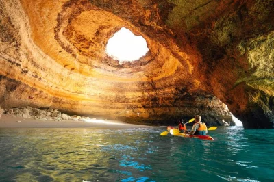 Watch the sun rise or set from your kayak inside benagil cave, with a small group and local guide. includes all equipment, safety gear, and beach meeting point.