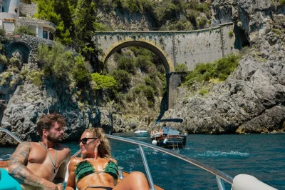 Trade city noise for sea air on an amalfi coast boat tour from naples, with stops in positano and amalfi, swimming breaks, and a light caprese lunch included.
