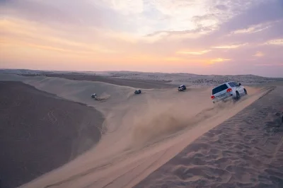 Feel the rush of a half-day desert safari from doha—dune bashing, salty sea air at khor al adaid, and local stories. includes private transfer & licensed driver.