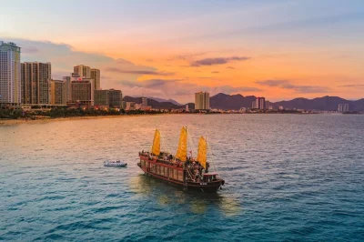 Watch the sun dip over nha trang bay on a sunset dinner cruise, with cocktails, live music, and a 5-course meal. includes hotel pickup and unlimited drinks.