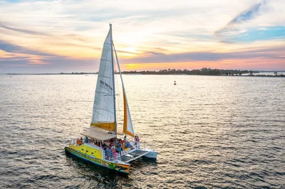 Feel the gulf breeze on a panama city beach sunset sail, spot dolphins, sip your complimentary drink, and unwind before dinner. includes bar & local crew.