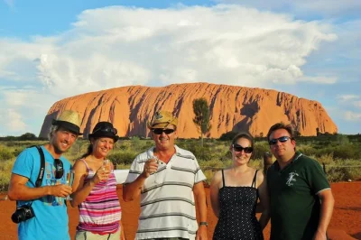 Feel the spirit of uluru on a day trip from alice springs with guided walks, aboriginal stories, and a sunset bbq dinner. includes pickup and all transport.