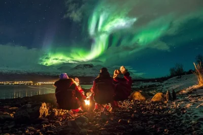 Chase the northern lights from tromsø with a local guide, warm meal by the bonfire, thermal suits, and pro photos included. pickup at magic ice bar.