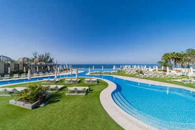 Soak up gran canaria sun at perchel beach club with infinity pool access, hammock, umbrella, and a three-course lunch. includes welcome drink and family-friendly spaces.