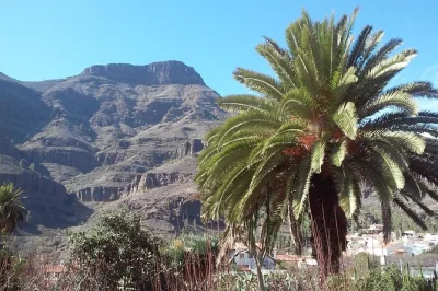 Start at las palmas and cross gran canaria’s wild heart—bandama caldera, santa brígida’s old cafés, pico de las nieves views, fataga lunch & maspalomas dunes. includes english guide & pickup.